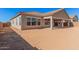 Sandy backyard with a covered patio at 24041 N 171St Ln, Surprise, AZ 85387