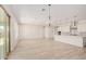 Open dining area with large windows and sliding glass doors at 24041 N 171St Ln, Surprise, AZ 85387