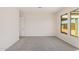 Well-lit bedroom with neutral carpeting and large windows at 24041 N 171St Ln, Surprise, AZ 85387