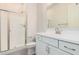 Modern bathroom with a walk-in shower and white vanity at 24041 N 171St Ln, Surprise, AZ 85387