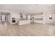 Open concept kitchen and dining area with hardwood floors at 24041 N 171St Ln, Surprise, AZ 85387