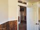 Bright hallway with wood-paneled walls and tile flooring at 6547 E Sierra Morena St, Mesa, AZ 85215