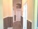 Long hallway with wood-paneled walls and tile floor at 6547 E Sierra Morena St, Mesa, AZ 85215