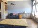 Cozy living room features a leather couch, wood-look floors, and built-in shelving at 6547 E Sierra Morena St, Mesa, AZ 85215