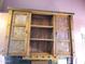 Wooden bathroom cabinet with glass doors at 6547 E Sierra Morena St, Mesa, AZ 85215