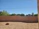 Backyard view with block wall and gravel at 6547 E Sierra Morena St, Mesa, AZ 85215
