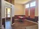 Retro-style dining room with wood paneling and large windows at 6547 E Sierra Morena St, Mesa, AZ 85215