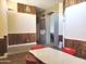 Bright dining area with wood wall accents and retro table set at 6547 E Sierra Morena St, Mesa, AZ 85215