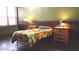 Bedroom with a single bed, wood furniture, and wood floors at 6547 E Sierra Morena St, Mesa, AZ 85215