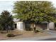 One-story house with a two-car garage, landscaping, and desert trees at 914 W Desert Seasons Dr, San Tan Valley, AZ 85143