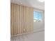 Bedroom with wood accent wall and a large window at 5530 S 111Th St, Mesa, AZ 85212