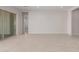 Spacious living room with tile floors and sliding glass door at 24030 N 171St Dr, Surprise, AZ 85387