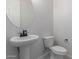 Simple bathroom with pedestal sink and toilet at 24030 N 171St Dr, Surprise, AZ 85387