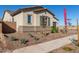 Single-story home with desert landscaping and a reddish-brown tile roof at 24030 N 171St Dr, Surprise, AZ 85387