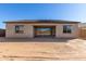 Large backyard with sandy ground and partial home view at 24030 N 171St Dr, Surprise, AZ 85387