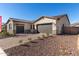 Single-story home with two-car garage and landscaped front yard at 24030 N 171St Dr, Surprise, AZ 85387