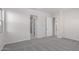 Well-lit bedroom featuring grey carpet and en-suite bathroom at 24030 N 171St Dr, Surprise, AZ 85387