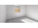 Bright and airy bedroom with neutral carpeting and large window at 24030 N 171St Dr, Surprise, AZ 85387