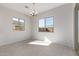 Bright dining room with tile floors and large windows at 24030 N 171St Dr, Surprise, AZ 85387