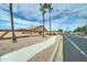 Meridian Manor 55+ community entrance with gated access and walkway at 2101 S Meridian Rd # 215, Apache Junction, AZ 85120