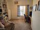 Home office with built-in shelving and comfortable seating at 2101 S Meridian Rd # 215, Apache Junction, AZ 85120