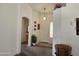 Inviting entryway with decorative accents and view to living room at 2101 S Meridian Rd # 215, Apache Junction, AZ 85120
