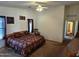 Large bedroom with king-size bed and access to bathroom at 2101 S Meridian Rd # 215, Apache Junction, AZ 85120