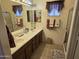 Double vanity bathroom with large mirror and shower/tub combo at 2101 S Meridian Rd # 215, Apache Junction, AZ 85120