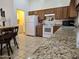 Kitchen boasts granite counters and easy access to laundry at 2101 S Meridian Rd # 215, Apache Junction, AZ 85120