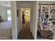 Home hallway with built-in shelving and view into bathroom at 2101 S Meridian Rd # 215, Apache Junction, AZ 85120
