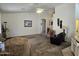 Spacious living area with ample natural light and views to hallway at 2101 S Meridian Rd # 215, Apache Junction, AZ 85120