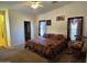 Spacious bedroom with king-size bed and ensuite bathroom access at 2101 S Meridian Rd # 215, Apache Junction, AZ 85120