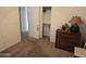 Bedroom with dresser, closet, and neutral decor at 2101 S Meridian Rd # 215, Apache Junction, AZ 85120