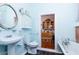 Bathroom with pedestal sink, toilet and clawfoot tub at 711 E Mckinley St, Phoenix, AZ 85006