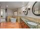 Luxurious bathroom with a freestanding tub and double vanity at 10284 E Filaree Ln, Scottsdale, AZ 85262