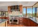 Modern kitchen with stainless steel appliances and granite counters at 10284 E Filaree Ln, Scottsdale, AZ 85262
