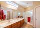 Double vanity bathroom with large mirror and walk-in shower at 28436 N 123Rd Ln, Peoria, AZ 85383