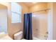 Bathroom with shower/tub combo and window at 28436 N 123Rd Ln, Peoria, AZ 85383