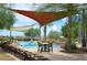 Relaxing pool area with shade structures and lounge chairs at 28436 N 123Rd Ln, Peoria, AZ 85383