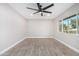 Spacious bedroom with wood-look tile flooring and a ceiling fan at 2033 W Sunnyside Ave, Phoenix, AZ 85029
