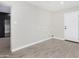 Bright laundry room with modern flooring and access to the kitchen at 2033 W Sunnyside Ave, Phoenix, AZ 85029