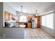 Modern kitchen with wood cabinets and tile floors at 20038 N 21St St, Phoenix, AZ 85024