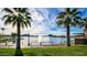 Lakefront view with fountain and palm trees at 17572 W Dalea Dr, Goodyear, AZ 85338