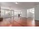 Bright living room featuring hardwood floors and a fireplace at 13451 N 93Rd Way, Scottsdale, AZ 85260