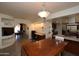 Bright dining area with wood table and view into kitchen and Gathering room at 4601 E Desert Cove Ave, Phoenix, AZ 85028