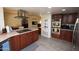 Spacious kitchen with island, stainless steel appliances, and wood cabinets at 4601 E Desert Cove Ave, Phoenix, AZ 85028