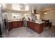 Kitchen with island, stainless steel appliances, and ample cabinet space at 4601 E Desert Cove Ave, Phoenix, AZ 85028