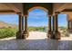 Inviting pool area with mountain views and covered patio at 11475 E Paradise Ln, Scottsdale, AZ 85255