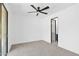 Bright bedroom with ceiling fan and access to patio at 11475 E Paradise Ln, Scottsdale, AZ 85255