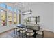 Elegant dining room with large windows and mountain views at 11475 E Paradise Ln, Scottsdale, AZ 85255